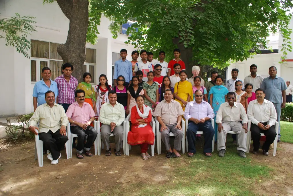 Group photograph with the Saksham students' delegation in the garden