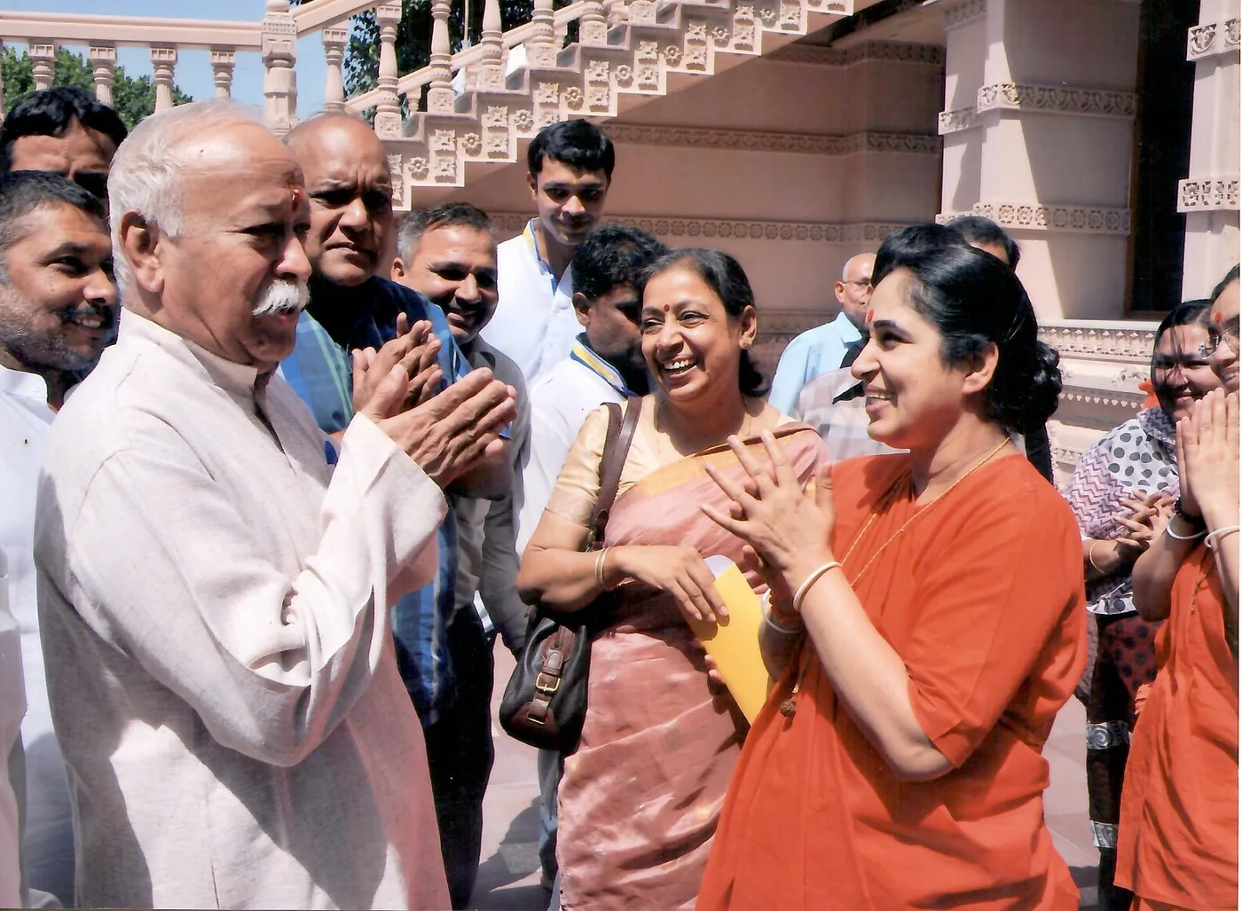 Greeting RSS Sarsanghchalak Mohan Bhagwat with folded hands at a temple complex